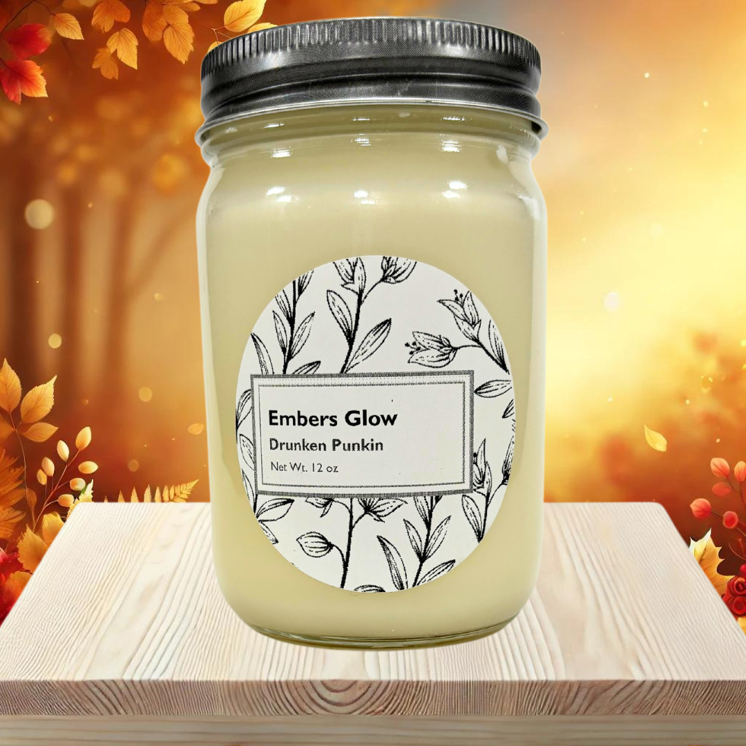 Glass jar candle with Drunken Punkin scent, featuring a blend of spiced pumpkin, vanilla, and bourbon, perfect for creating a cozy and playful fall atmosphere.