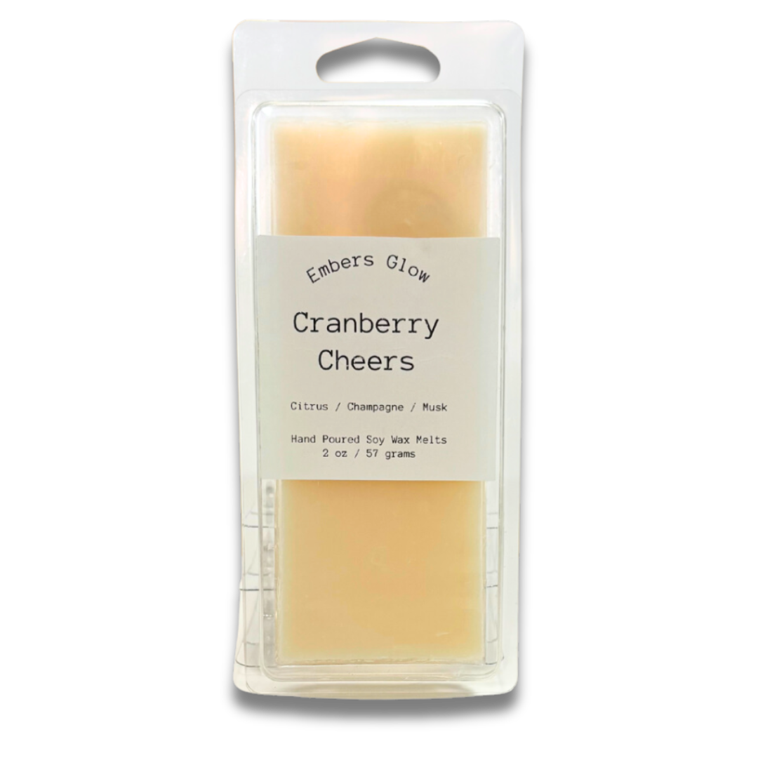 2 oz Cranberry Cheers soy wax melts with a festive blend of tart cranberries, sparkling citrus, and light spice, made from natural soy for a long-lasting, eco-friendly fragrance.